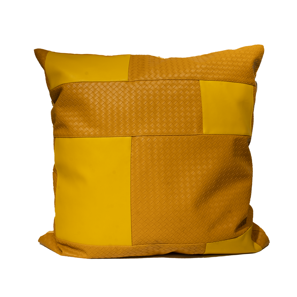 Yellow patchwork pillow on a white background