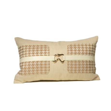 Decorative pillow with a houndstooth pattern and a gold buckle on a white background