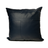 Black textured pillow on a white background