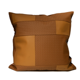 Brown pillow with woven pattern on a white background