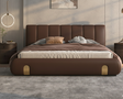 Brown leather bed with gold accents in a modern bedroom setting