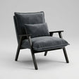 A modern accent chair with dark gray velvet cushions and a black wooden frame, shown against a neutral light gray background.