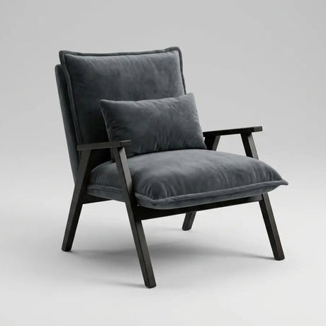 A modern accent chair with dark gray velvet cushions and a black wooden frame, shown against a neutral light gray background.