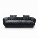 A modern two-seater sofa upholstered in a dark charcoal gray textured fabric, featuring two matching square throw pillows, shown against a plain white background.