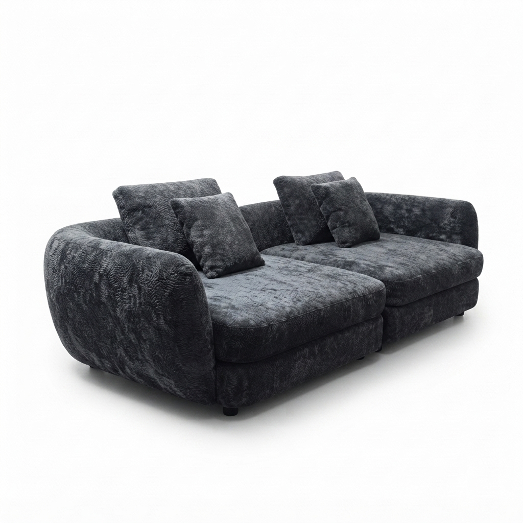A modern curved three-seater sofa upholstered in dark charcoal gray textured fabric, featuring four matching throw pillows, shown on a plain white background.